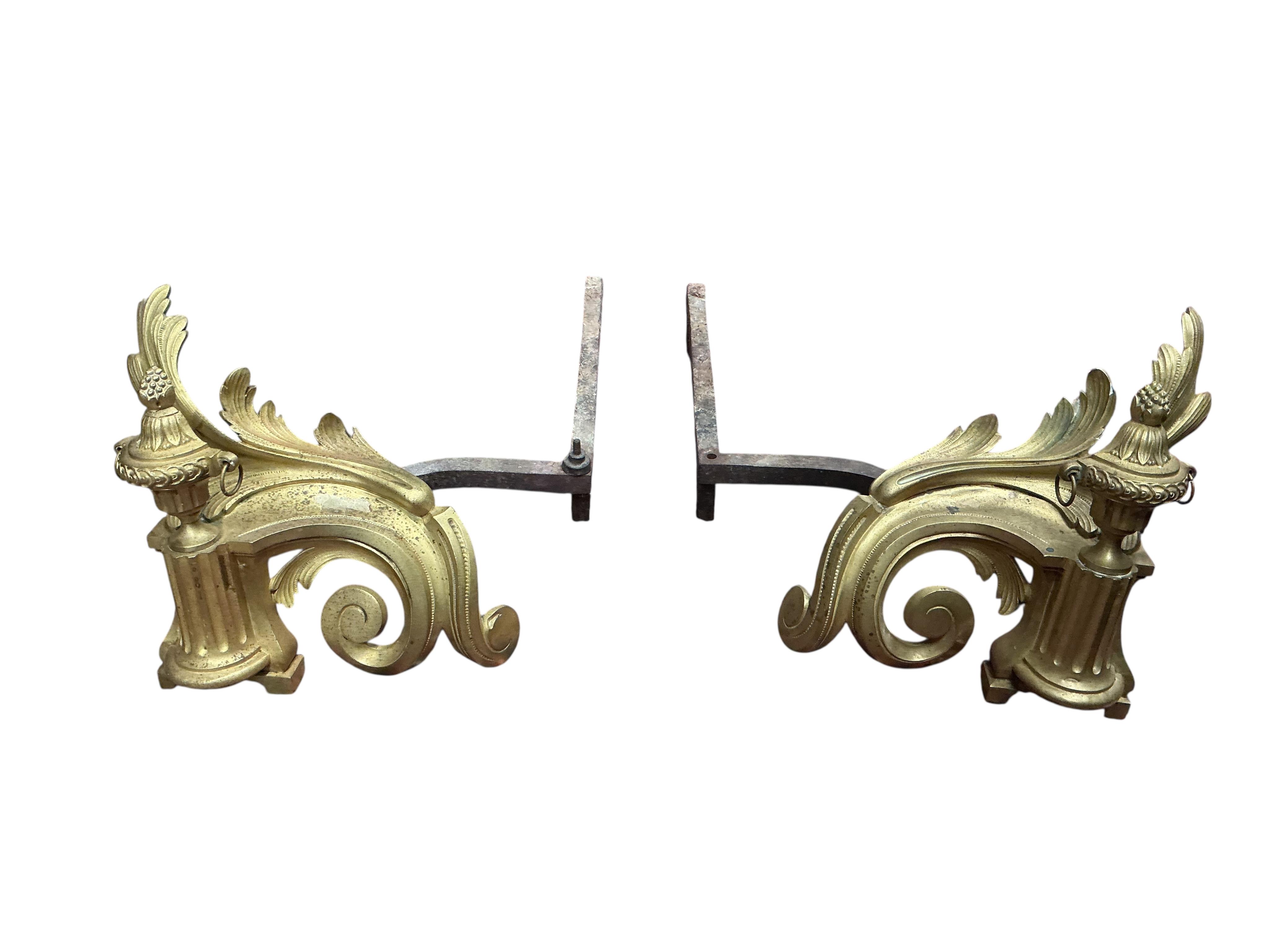 A pair of brass chenet